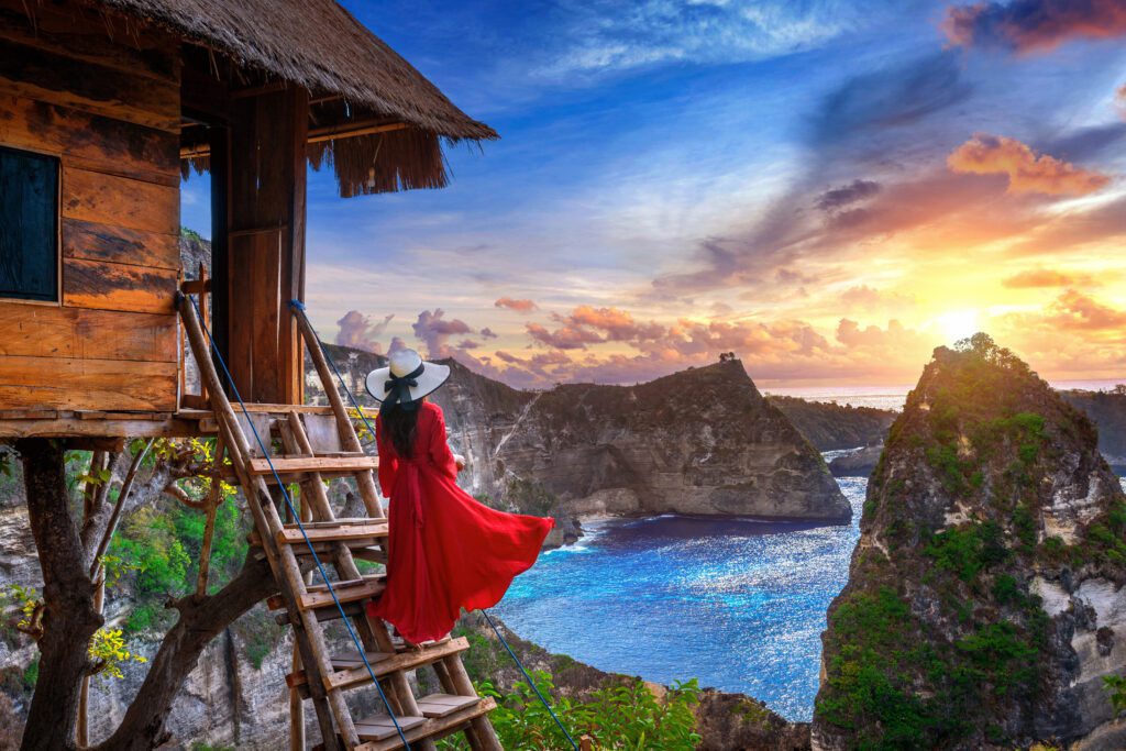 young-girl-steps-house-tree-sunrise-nusa-penida-island-bali-indonesia